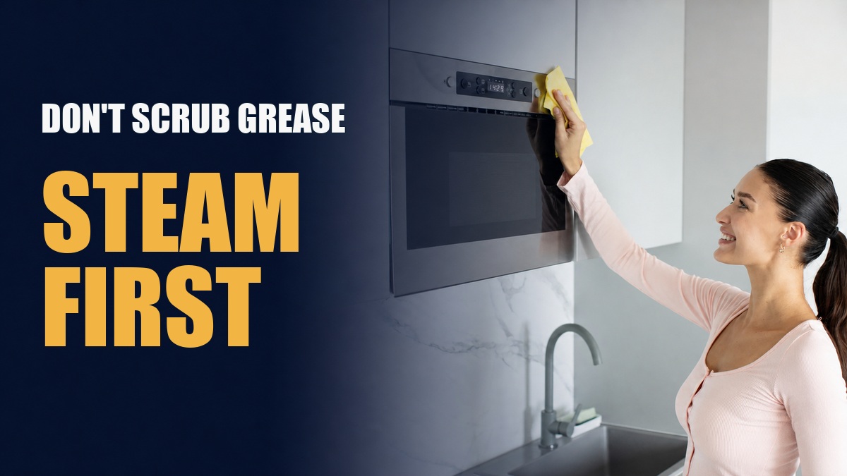 Woman cleaning a built-in microwave with the words Don’t Scrub Grease, Steam First.
