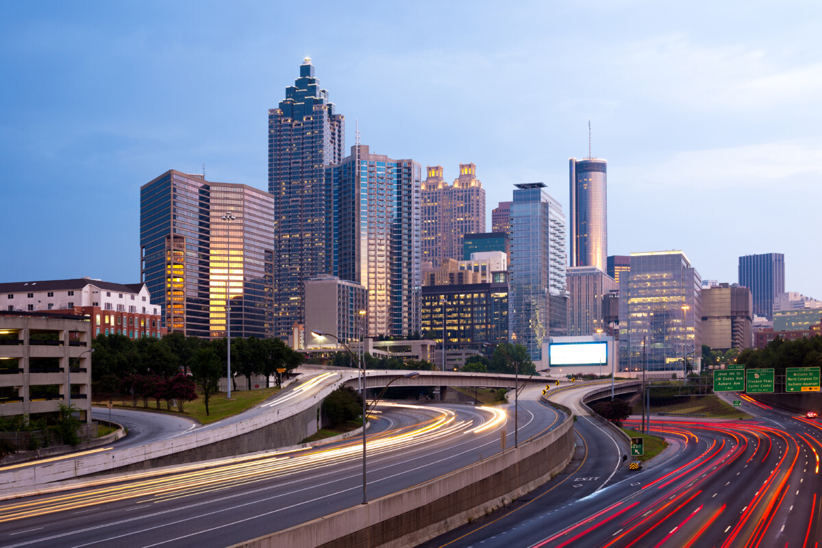Downtown Atlanta skyline and freeway at dusk