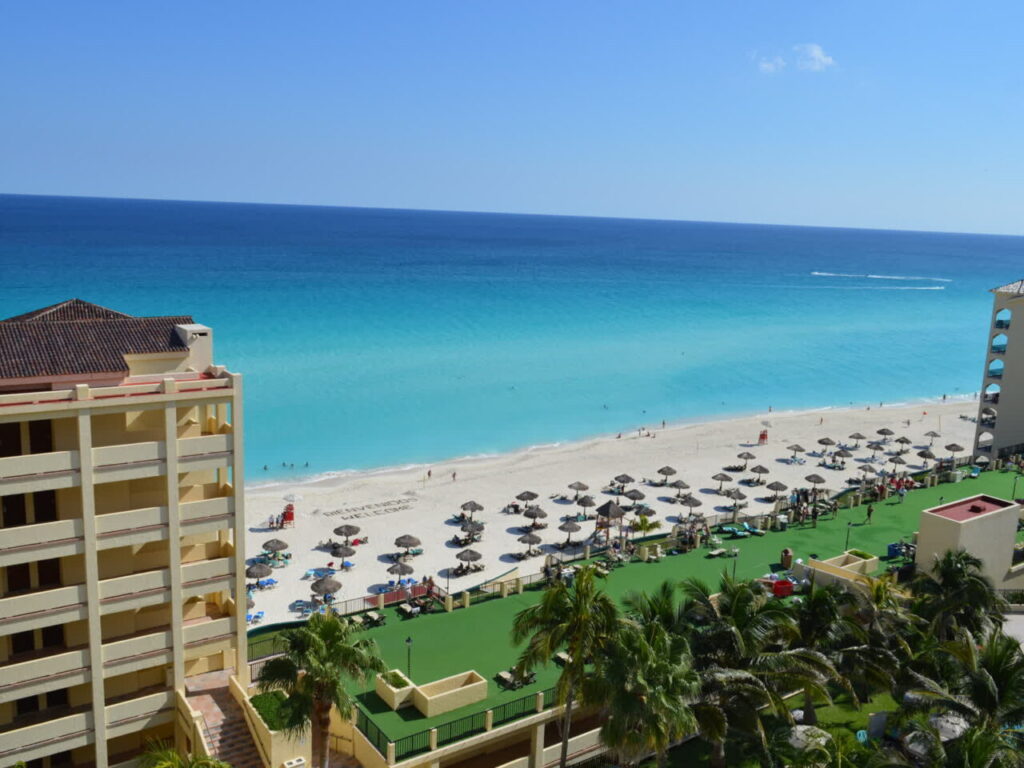 Cancun all inclusive resort cost at a beachfront pool