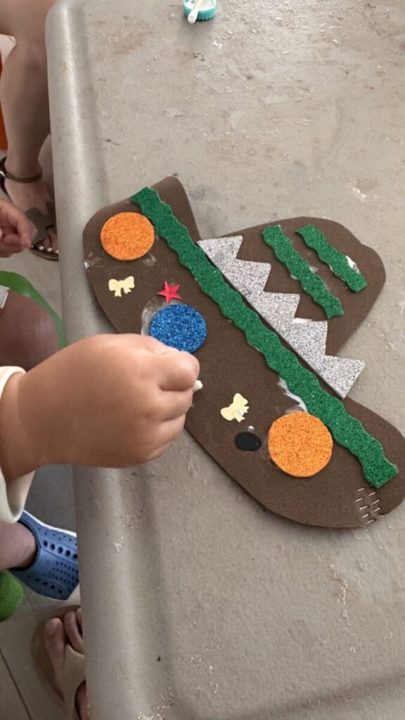 Child making a Mexican craft at the Finest Playa Mujeres kids club