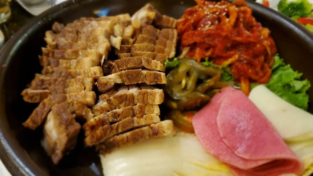 Bossam with sliced pork and accompaniments at Jang Su Jang Duluth