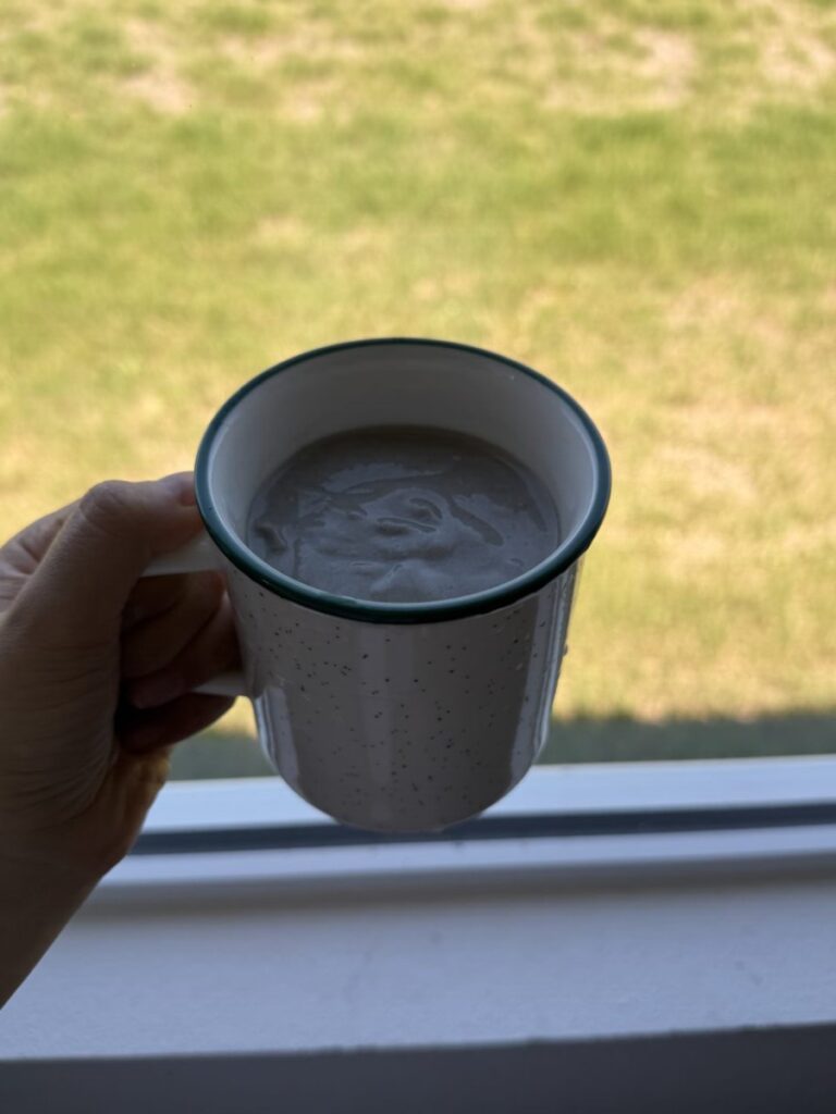 Fresh homemade soy milk in a glass mug